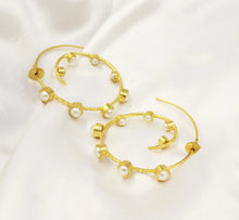 Spiral Hoop Earrings by Ira Aanya